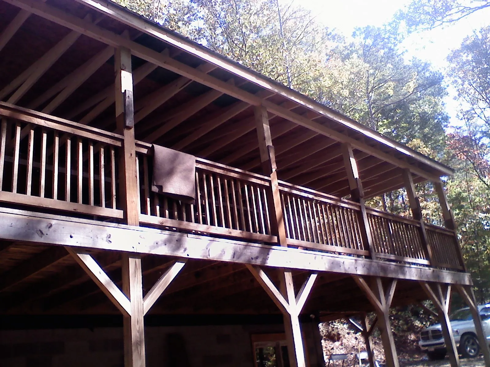 Timber framing under a new elevated porch and deck — Roof Leak Repair in South Windham by Roofing Brothers